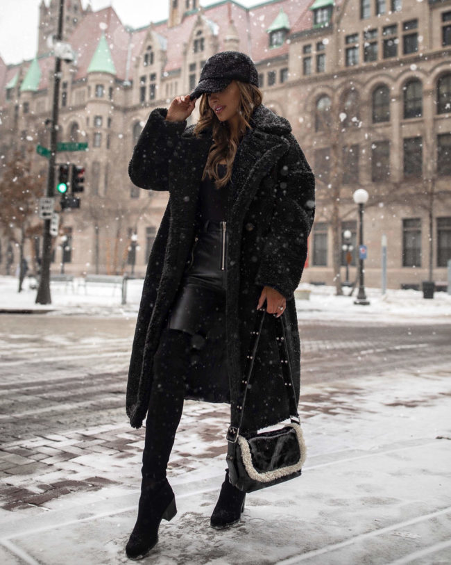 fashion blogger mia mia mine wearing a black teddy bear coat from nordstrom