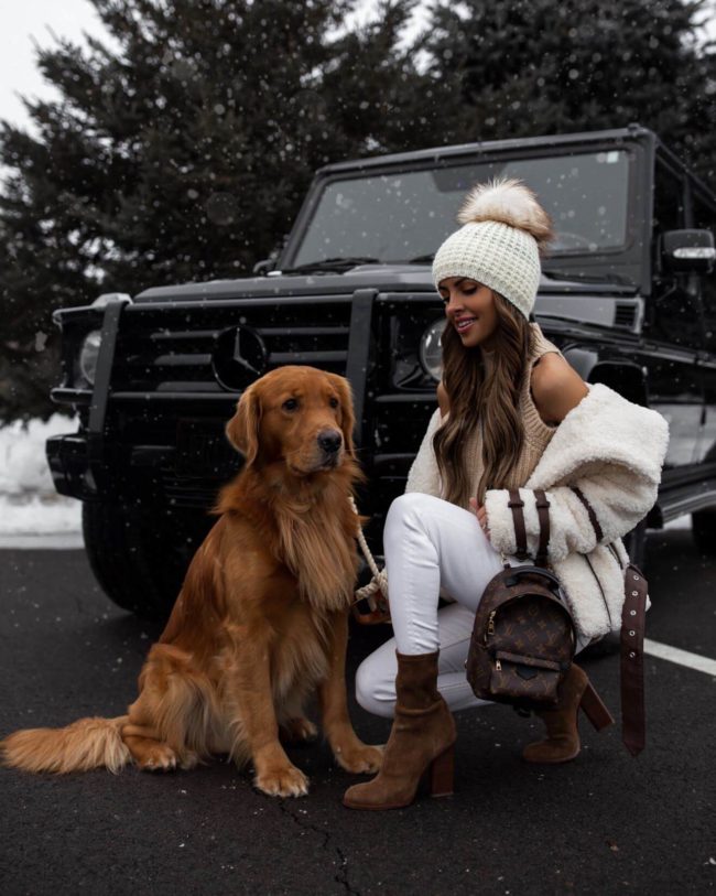 fashion blogger mia mia mine wearing a white sherpa coat from revolve