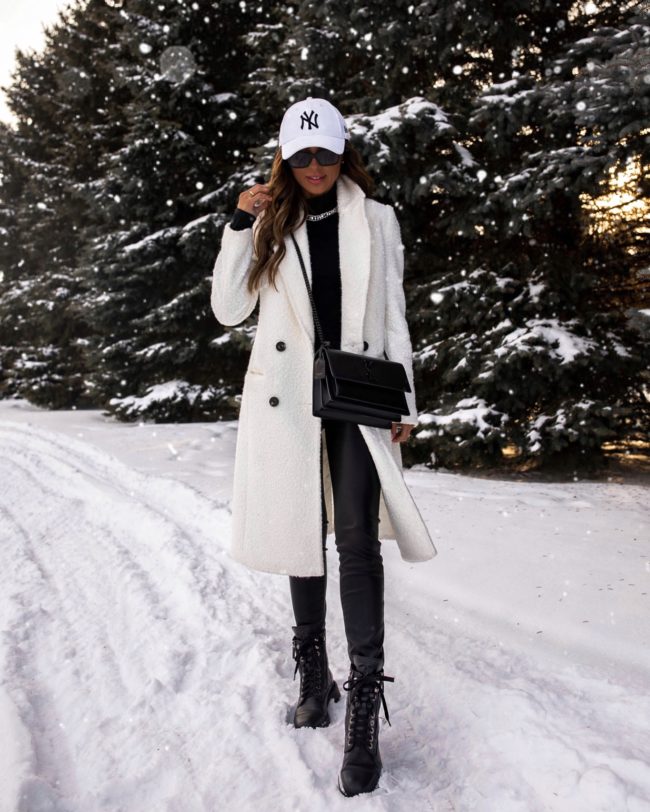 fashion blogger mia mia mine wearing a black and white winter outfit