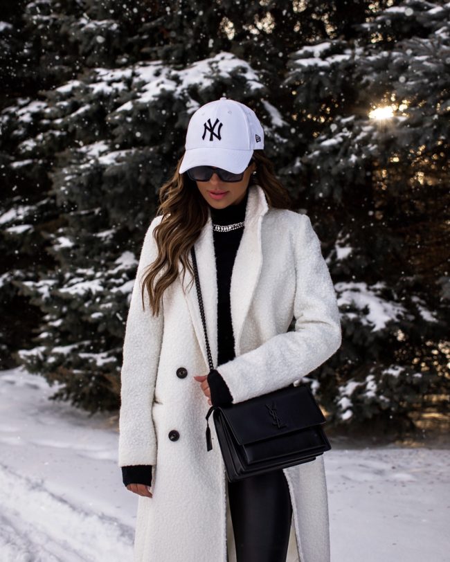 fashion blogger mia mia mine wearing a white sherpa coat from express and a saint laurent sunset bag