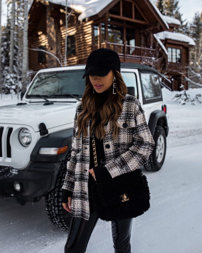 fashion blogger mia mia mine wearing a plaid shirt jacket with a faux fur baseball cap from nordstrom