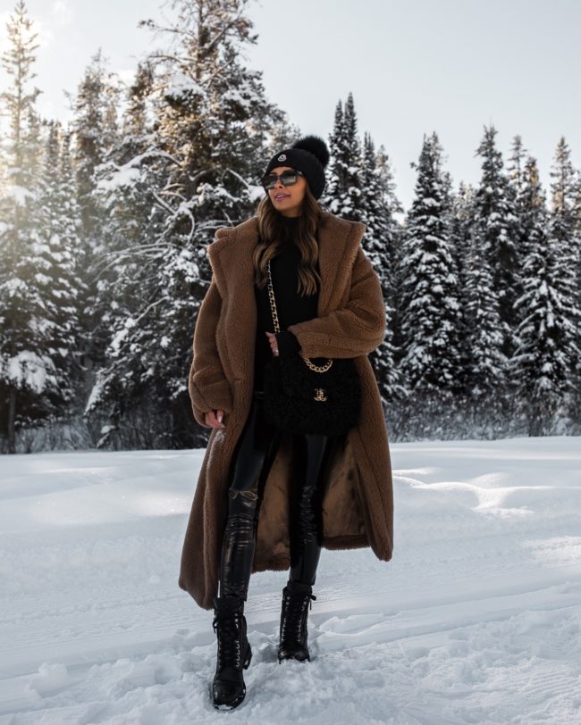 fashion blogger mia mia mine wearing a teddy bear coat with a shearling bag and combat boots