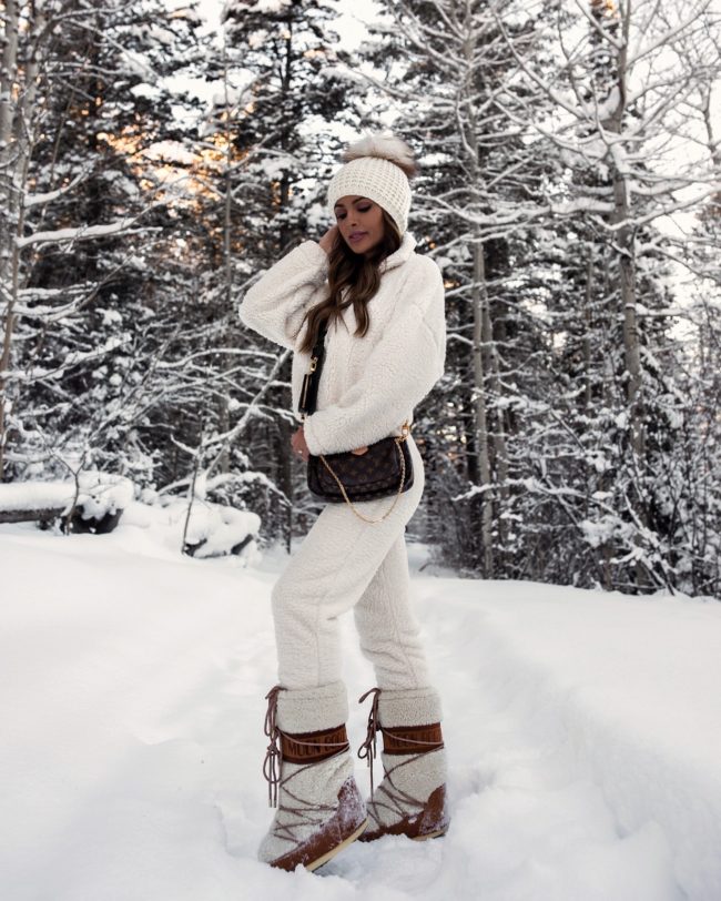 fashion blogger mia mia mine wearing a white sherpa jogger set from walmart
