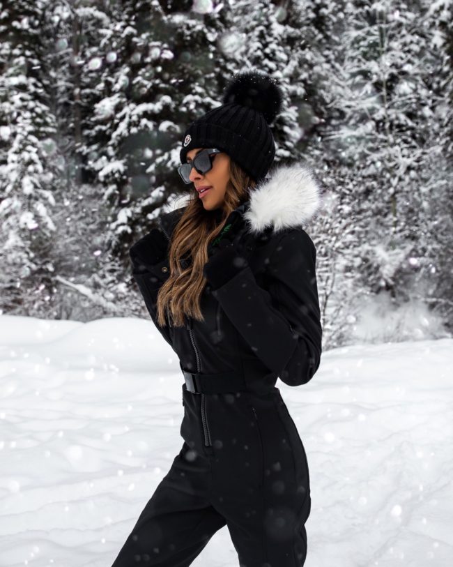 fashion blogger mia mia mine wearing a winter ski outfit in jackson hole