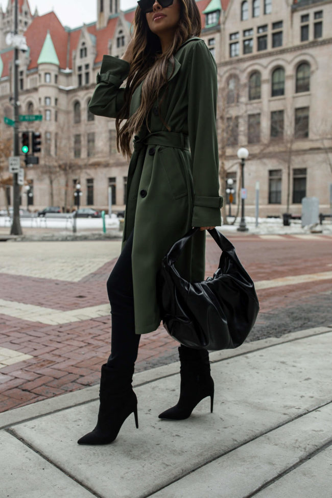 fashion blogger wearing slouchy boots from express