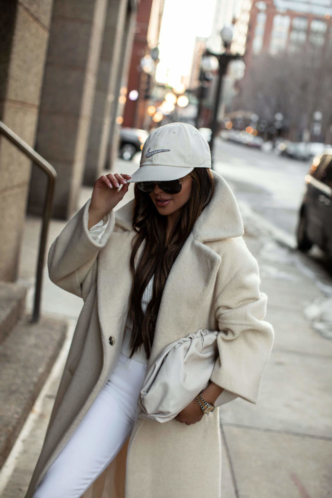 fashion blogger mia mia mine wearing a nike baseball cap from nordstrom