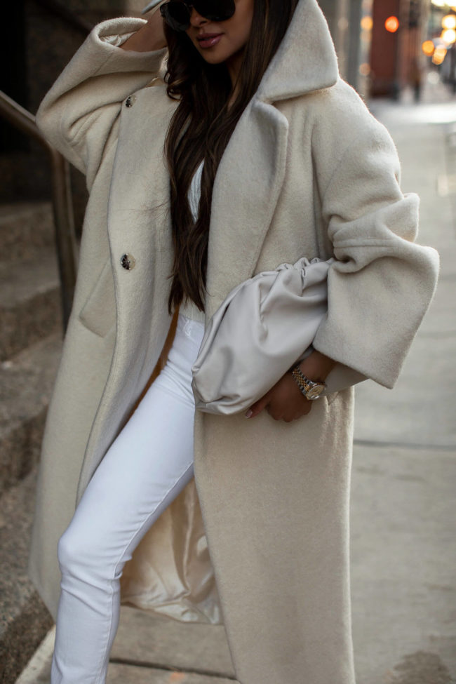 fashion blogger wearing an ivory topshop coat from nordstrom and mother denim