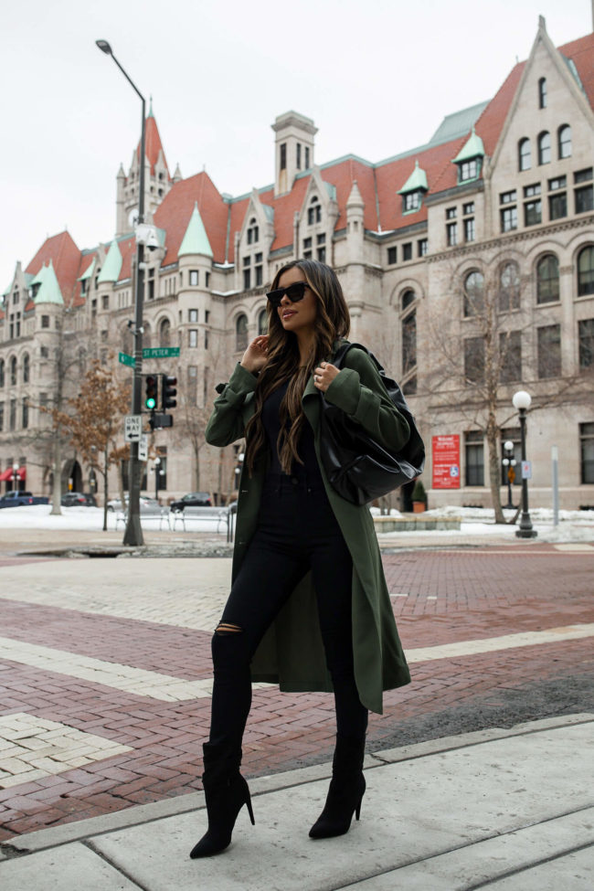 mia mia mine wearing an olive trench coat from express