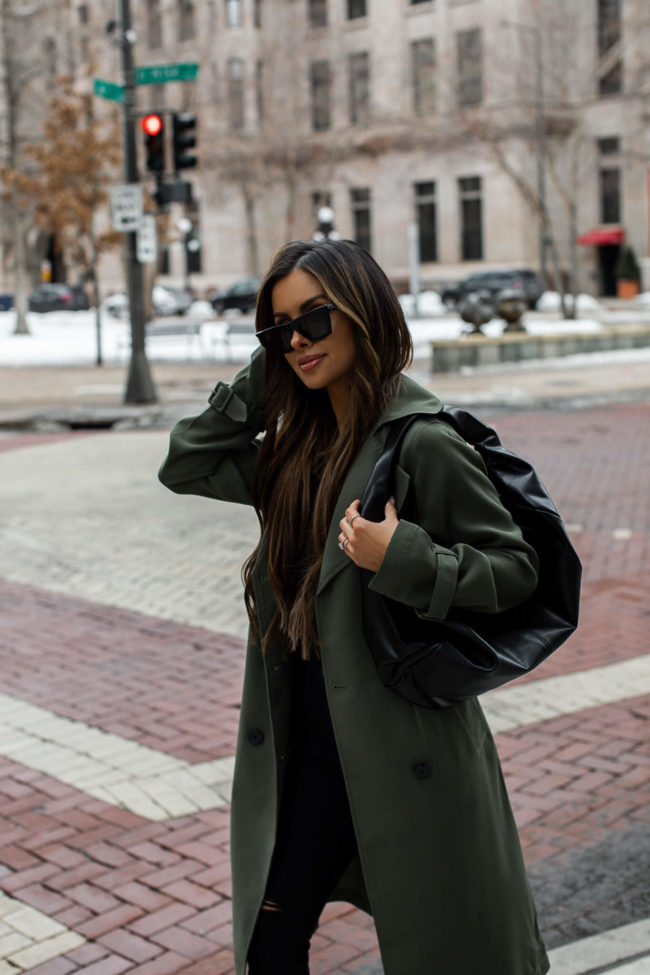 fashion blogger mia mia mine wearing a trench coat from express