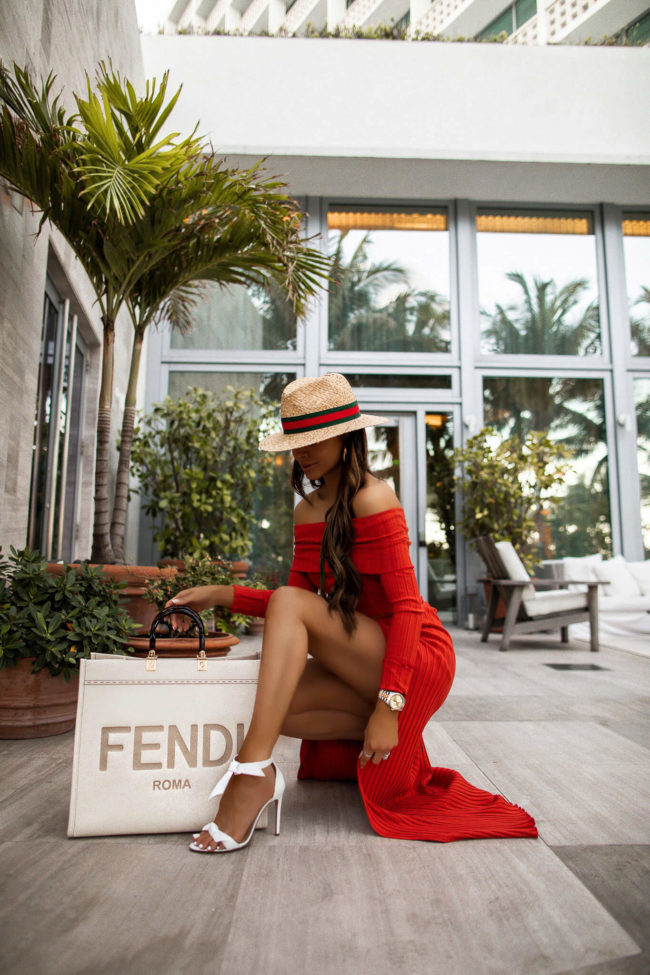 fashion blogger mia mia mine wearing a red matching set from revolve in miami