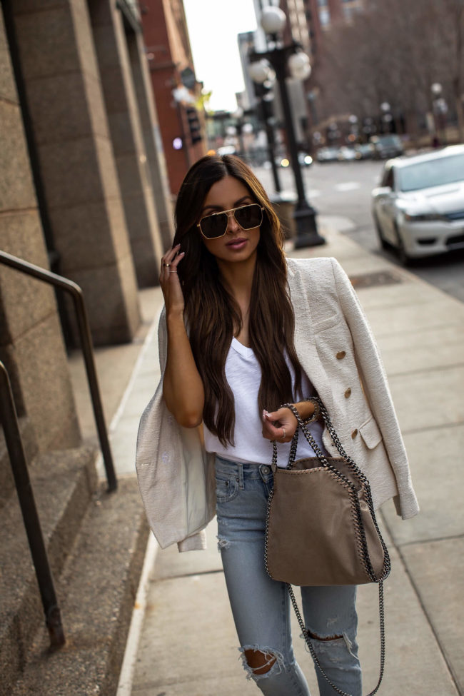 fashion blogger mia mia mine wearing a l'agence blazer and a stella mccartney bag