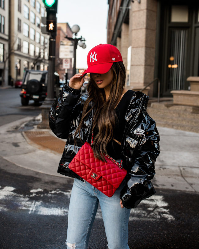 fashion blogger mia mia mine wearing a nike puffer jacket from revolve
