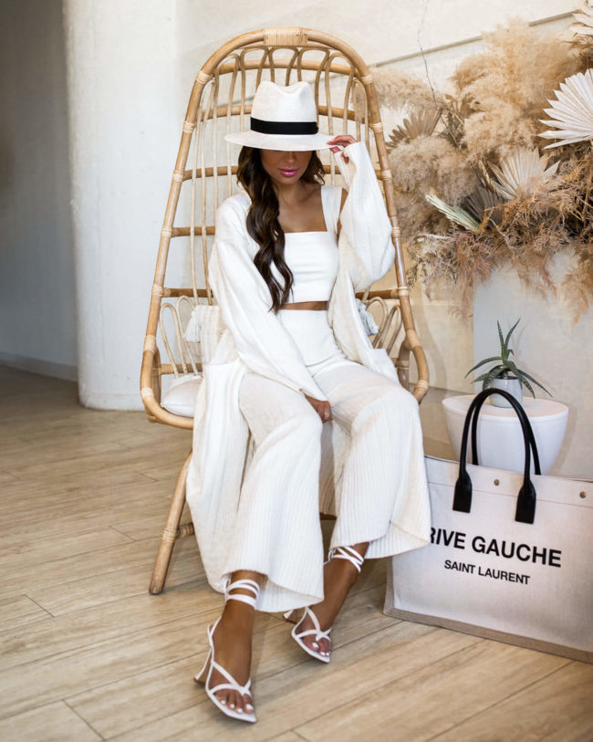 fashion blogger mia mia mine wearing a white outfit from revolve
