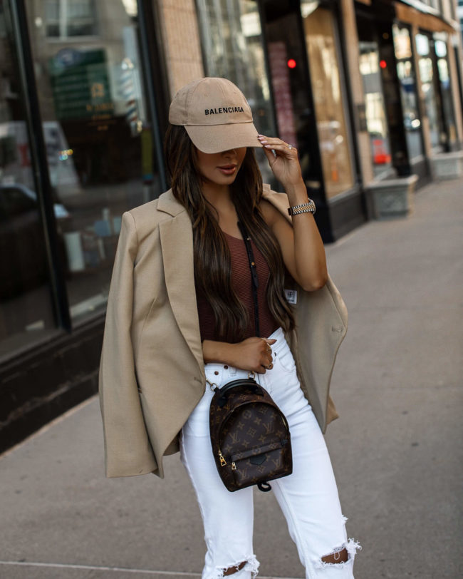 fashion blogger mia mia mine wearing a camel blazer by anine bing camel blazer and a balenciaga cap