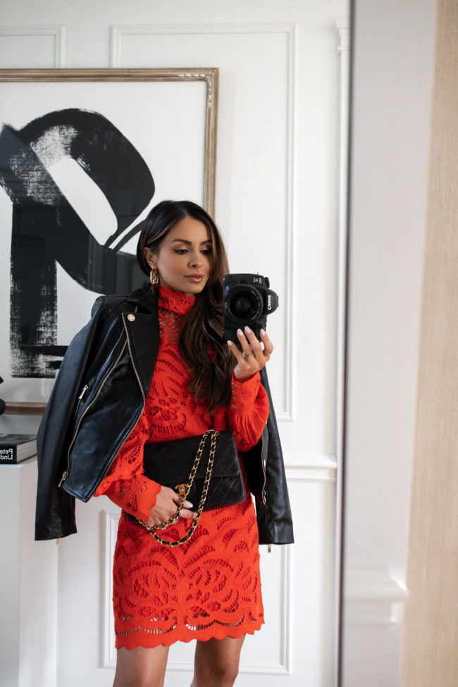 mia mia mine wearing a red lace dress and a black leather jacket from karen millen