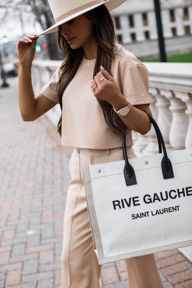 fashion blogger mia mia mine wearing a camel leather top and a saint laurent rive gauche tote