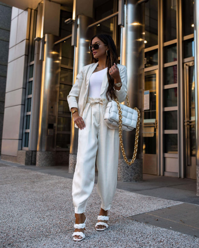 fashion blogger mia mia mine wearing a white suit from express