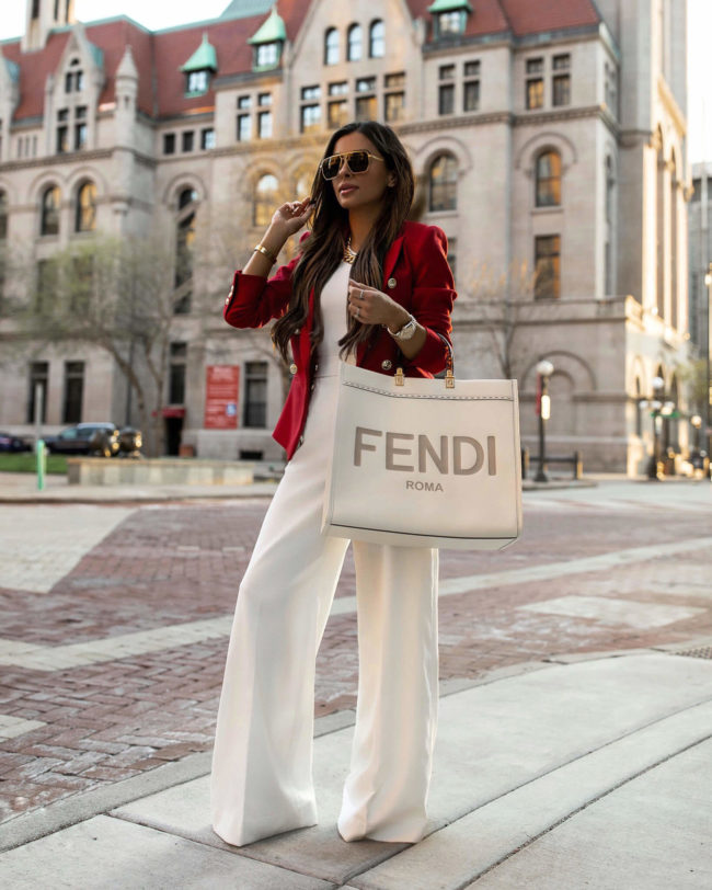 fashion blogger mia mia mine wearing karen millen white pants and a red blazer
