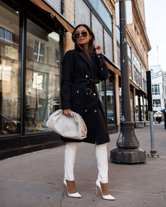 fashion blogger mia mia mine wearing a karl lagereld trench coat and white denim