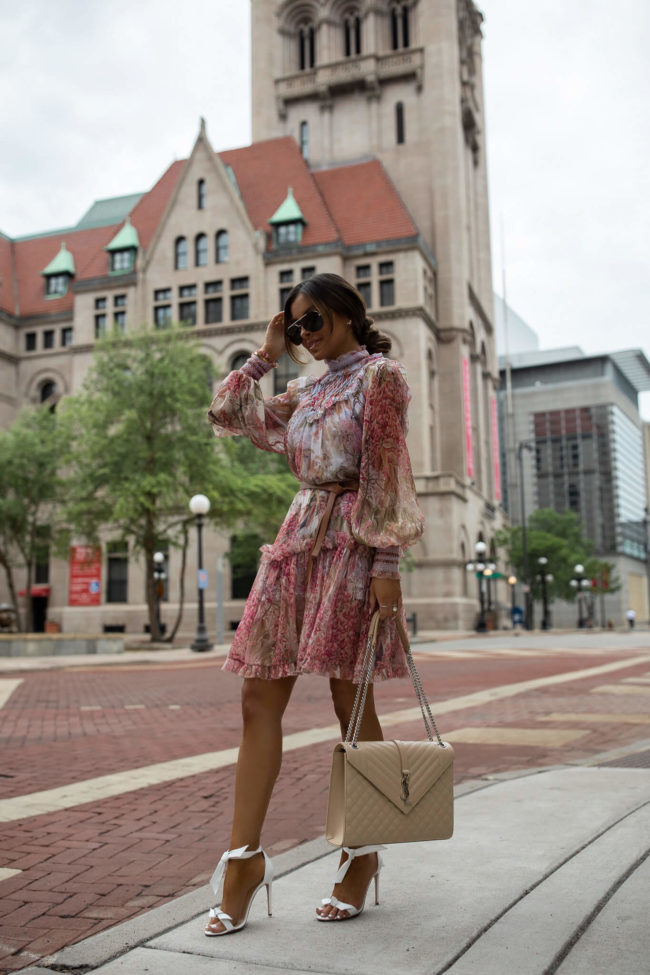 fashion blogger wearing a floral zimmerman dress for spring