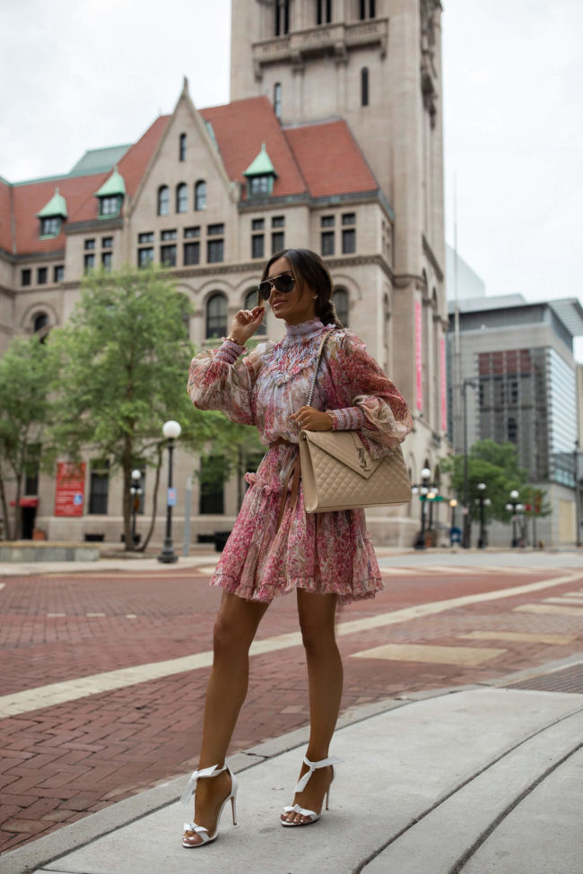 fashion blogger mia mia mine wearing a zimmerman floral dress for spring