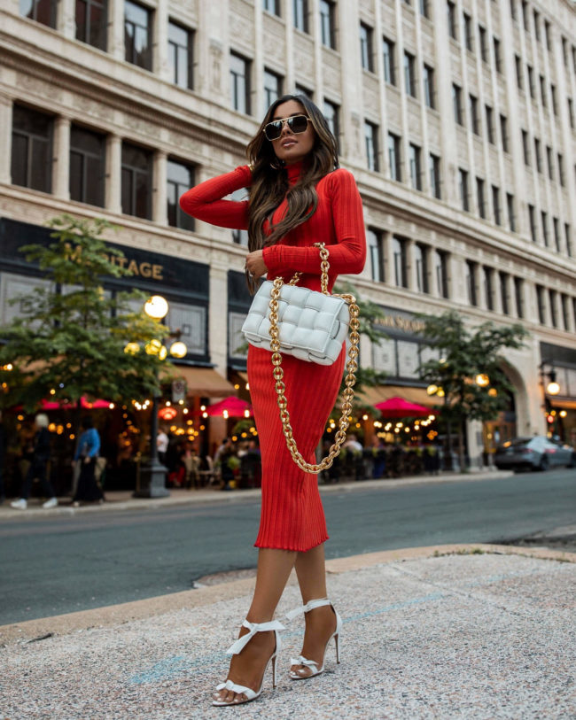 fashion blogger mia mia mine wearing a red dress from revolve for summer