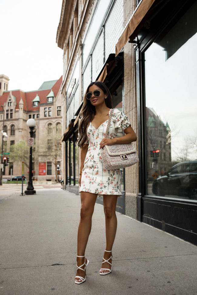fashion blogger mia mia mine wearing a floral dress for spring from saks off 5th