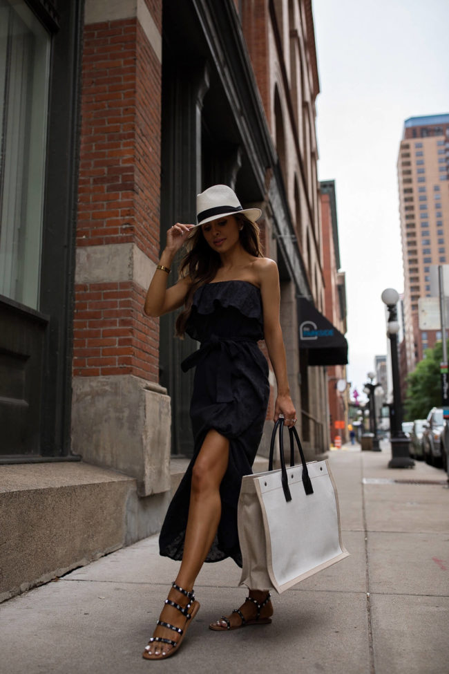 fashion blogger wearing a black strapless dress by sofia jeans from walmart