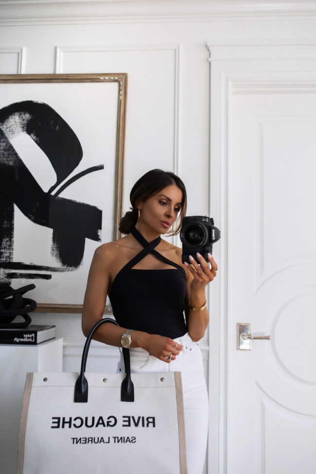 fashion blogger wearing a black and white summer outfit