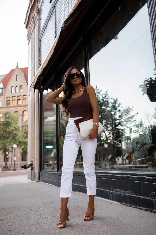 fashion blogger mia mia mine wearing a brown bodysuit from express