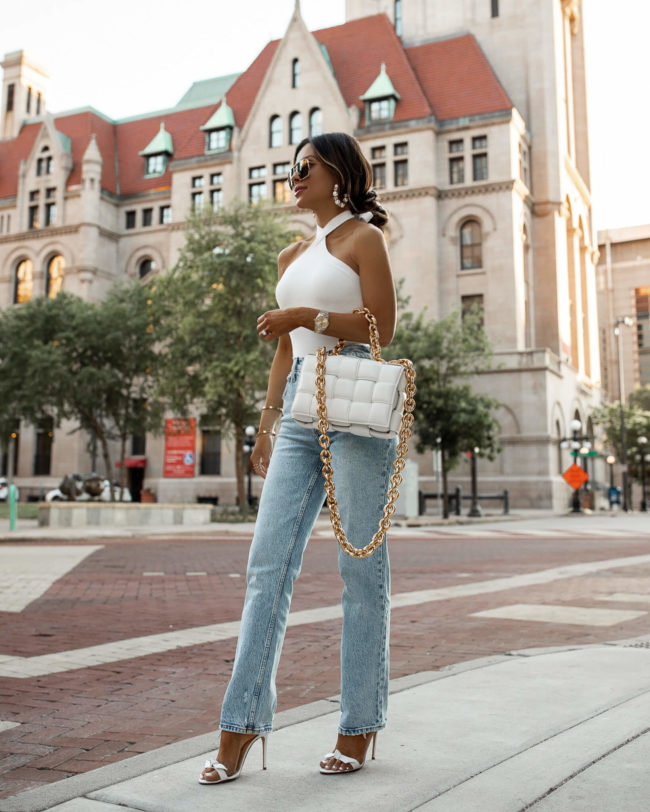 fashion blogger mia mia mine wearing a white knit bodysuit and denim from abercrombie