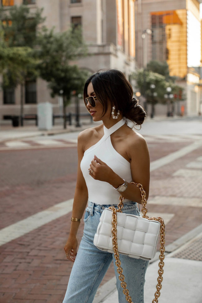 fashion blogger wearing a white halter bodysuit from abercrombie