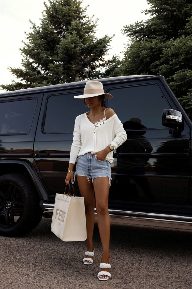 fashion blogger mia mia mine wearing a white henley and fendi sunshine tote