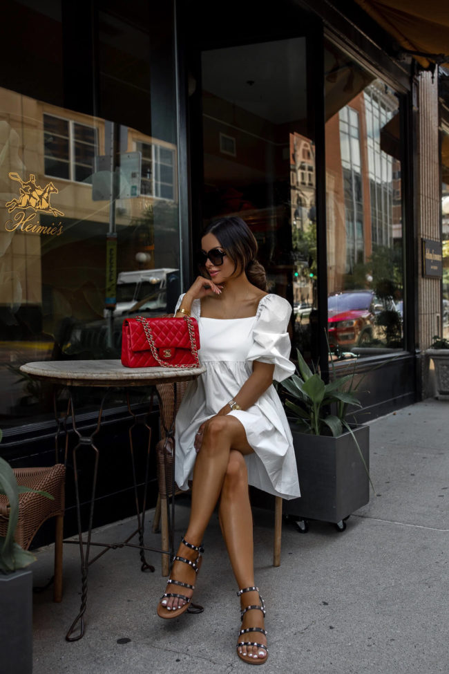 fashion blogger mia mia mine wearing a white summer dress from walmart's scoop line