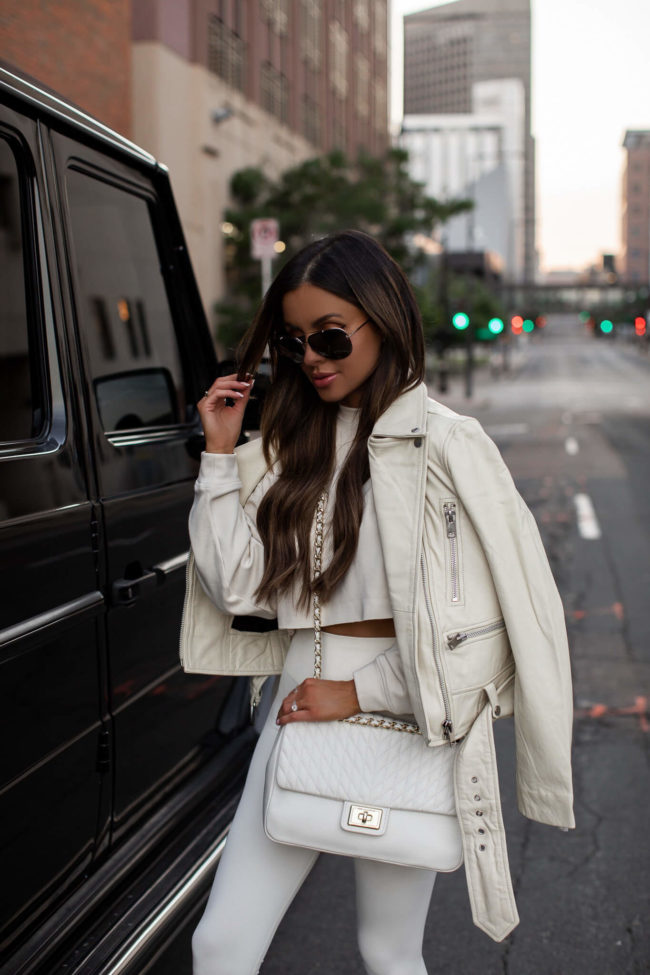 mia mia mine wearing an off-white leather jacket