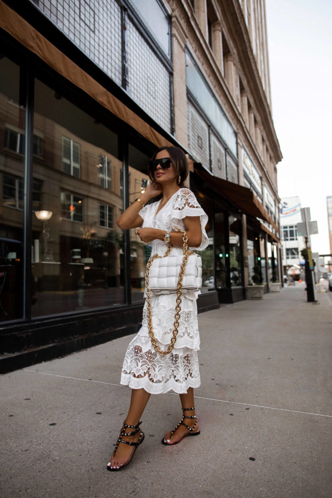fashion blogger wearing a farm rio white lace dress from neiman marcus