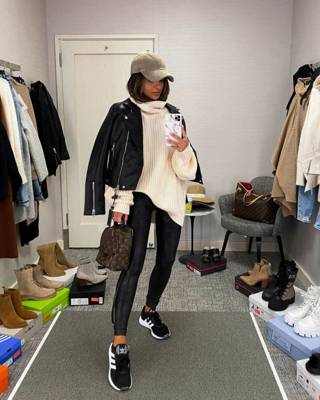 fashion blogger mia mia mine wearing a free people chunky knit sweater and adidas sneakers