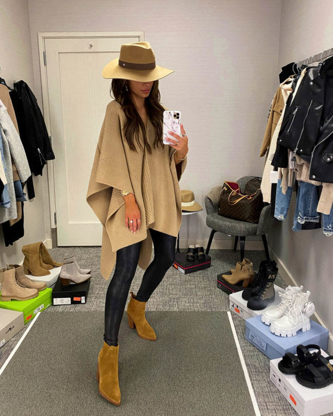 fashion blogger mia mia mine wearing a camel shawl and spanx faux leather leggings from the nordstrom anniversary sale