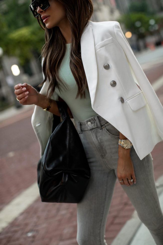 fashion blogger wearing a mint green bodysuit from express
