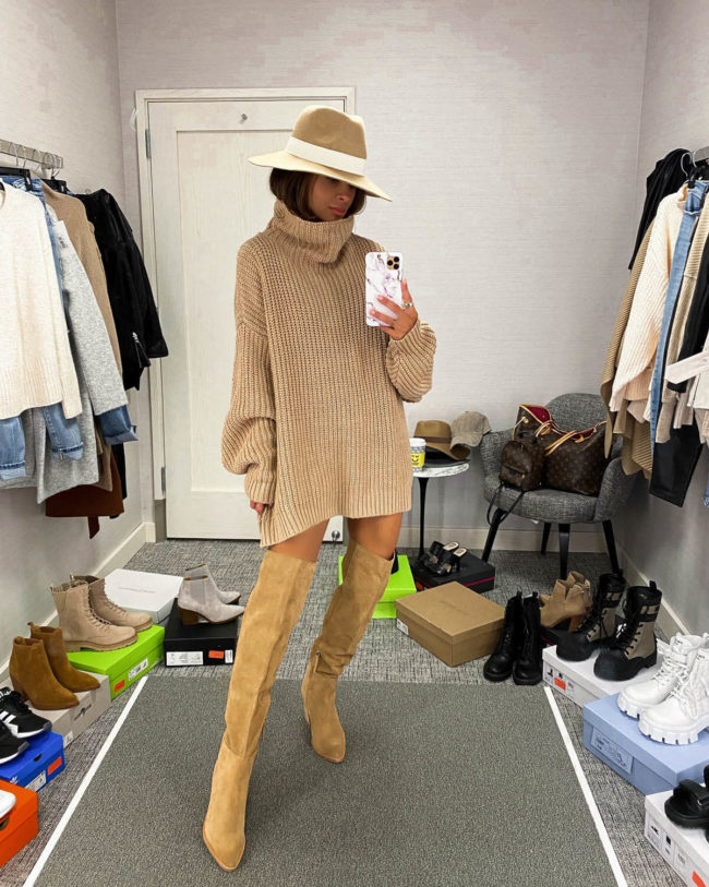 fashion blogger mia mia mine wearing a camel sweater dress with over the knee boots from the nsale