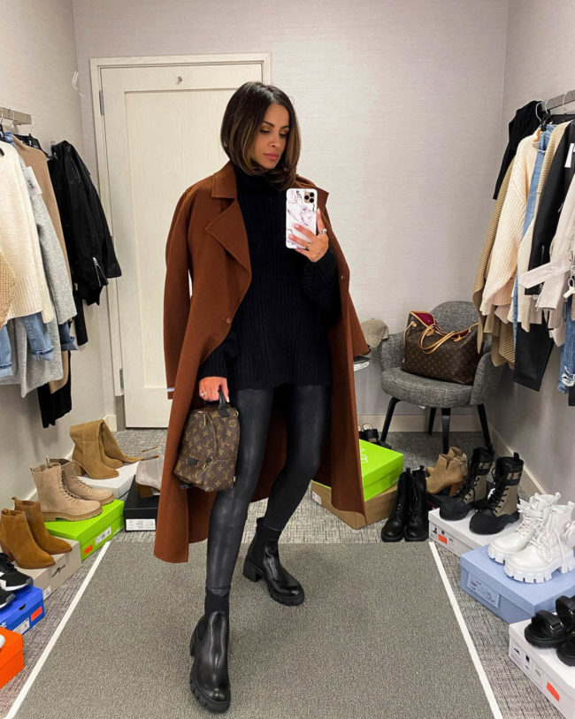 fashion blogger mia mia mine wearing an all black outfit with a brown wrap coat from the nordstrom anniversary sale