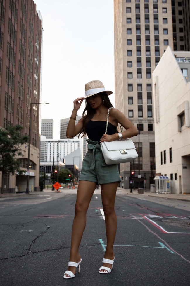 mia mia mine wearing paperbag shorts and white heels from saks off 5th