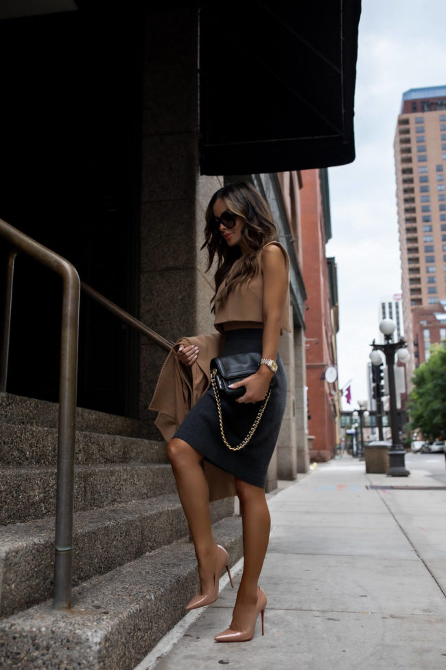 fashion blogger mia mia mine wearing a camel dress from rent the runway