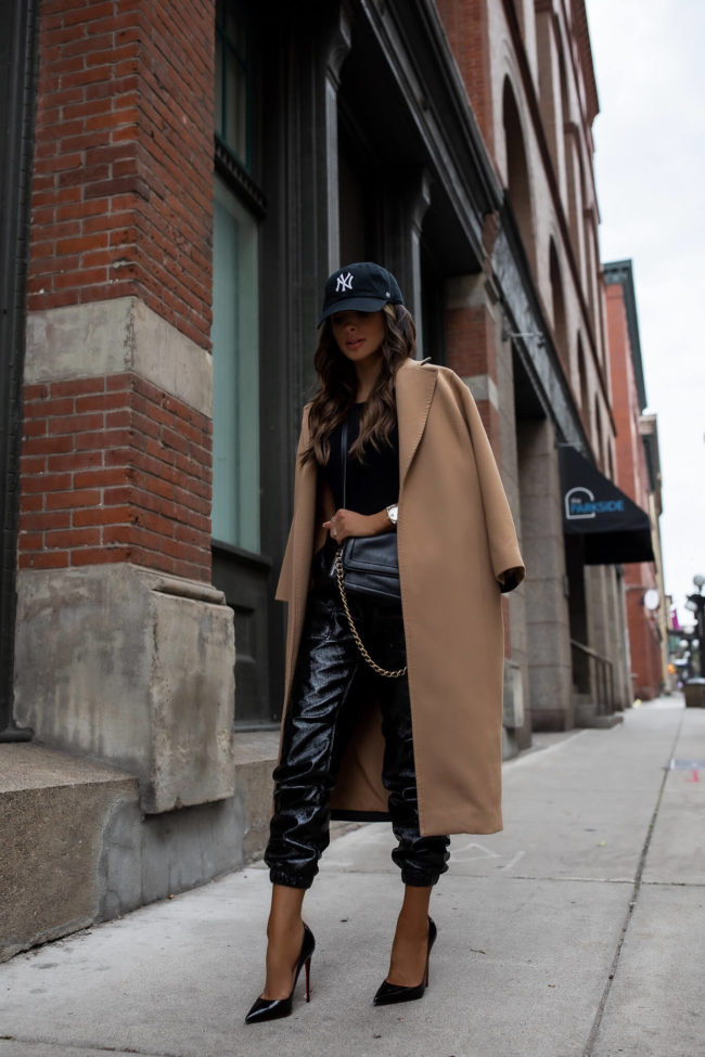 fashion blogger wearing a camel coat from rent the runway