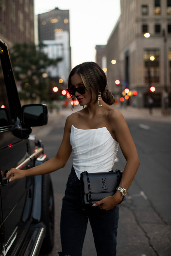 fashion blogger mia mia mine wearing a white corset top from amazon