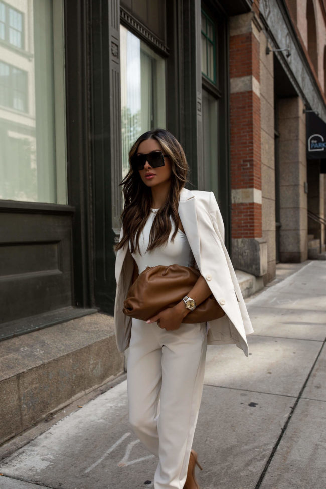 fashion blogger wearing a white bodysuit from express 