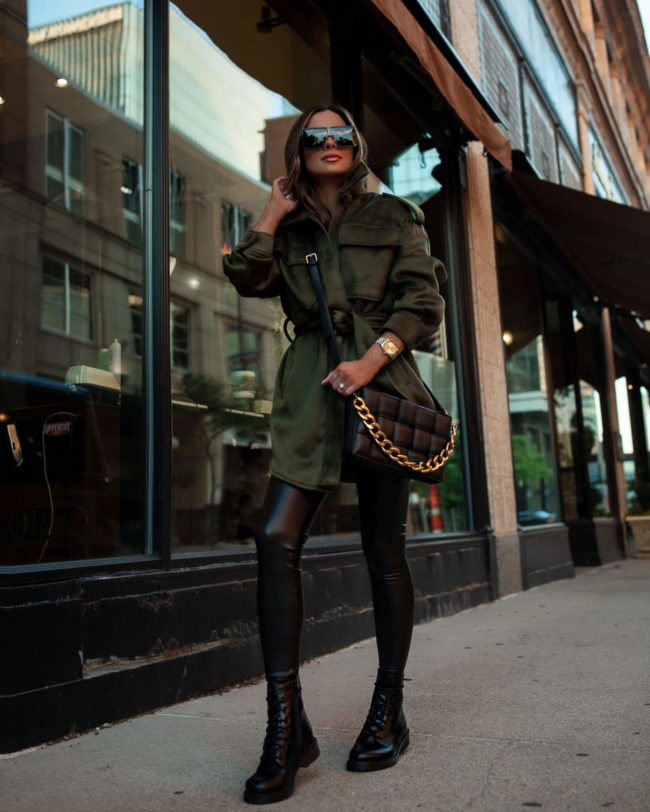 fashion blogger mia mia mine wearing faux leather leggings and black combat boots from walmart