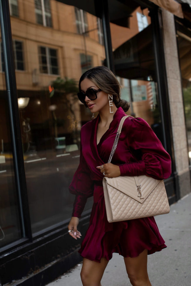 fashion blogger mia mia mine wearing a burgundy zimmermann silk dress for fall 