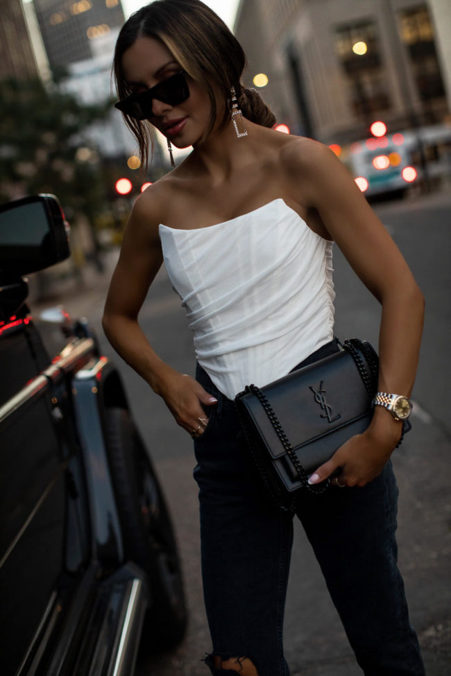 mia mia mine wearing a white corset top from amazon