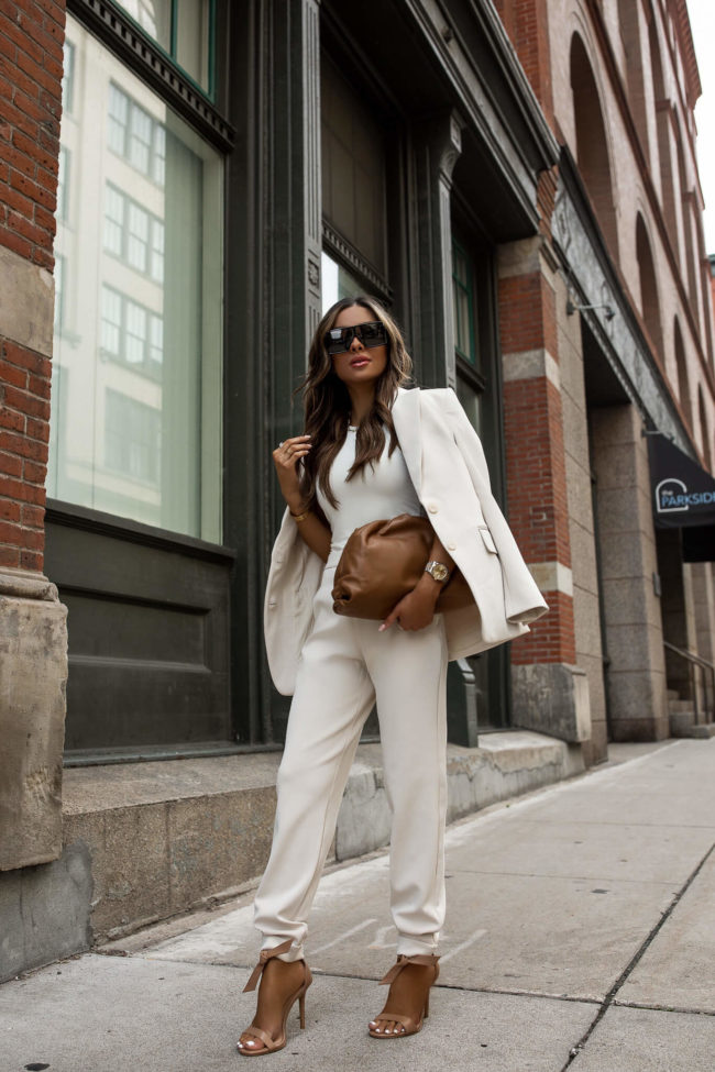 mia mia mine wearing a white suit from express for summer